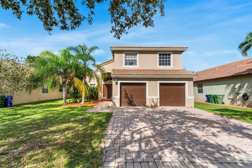 Beautiful 4-bedroom, 2.5-bathroom home, located in the highly sought-after community of Sunset Lakes